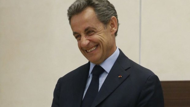 Former French president Nicolas Sarkozy waits for a meeting with Russian President Vladimir Putin.