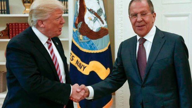 US President Donald Trump shakes hands with Russian Foreign Minister Sergey Lavrov in the White House in Washington.
