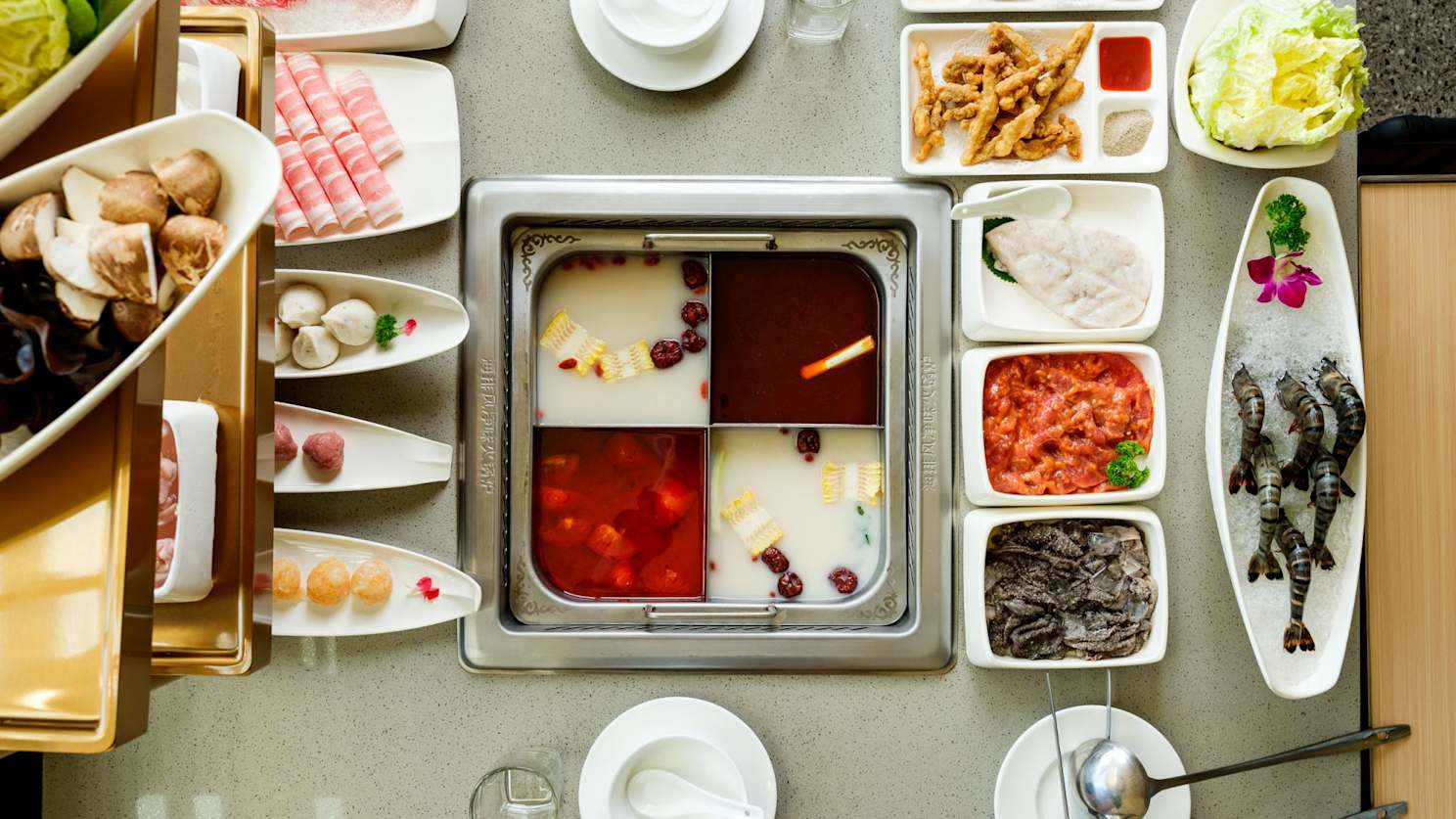 Split pot with different broths at Haidilao, Melbourne CBD