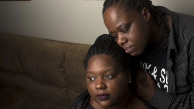 Romechia Simms, left, with her mother, Vontasha Simms, in their home.
