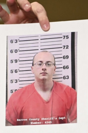 Barron County Sheriff Chris Fitzgerald holds up the booking photo of Jake Thomas Patterson, who allegedly kidnapped Jayme Closs.