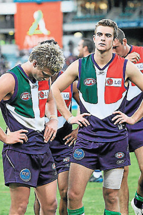 Dejected Dockers players after the narrow loss.