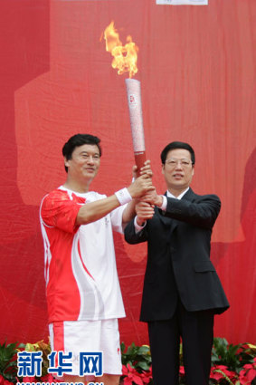 Zhang Gaoli, the former Chinese vice-premier accused of sexually assaulting Peng Shuai, holding the Beijing 2008 Olympic torch. 
