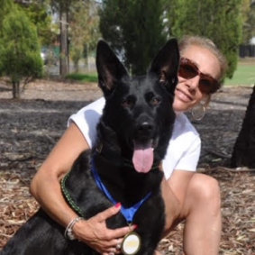 Trish Cavarra, the owner of Four Paws K9 Training, with her dog Raine.