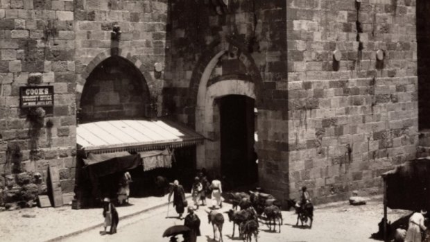 An 1894 photograph from Maison Bonfils of Jerusalem's Jaffa Gate. A sign on the left directs visitors to "Cook's Tourist Office". Thomas Cook began taking tourists to Palestine in 1869.
