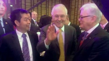 Prime Minister Malcolm Turnbull and then trade envoy Andrew Robb in Beijing in April 2016 with Landbridge head Ye Cheng. Three months later, Mr Robb was on Landbridge's payroll.