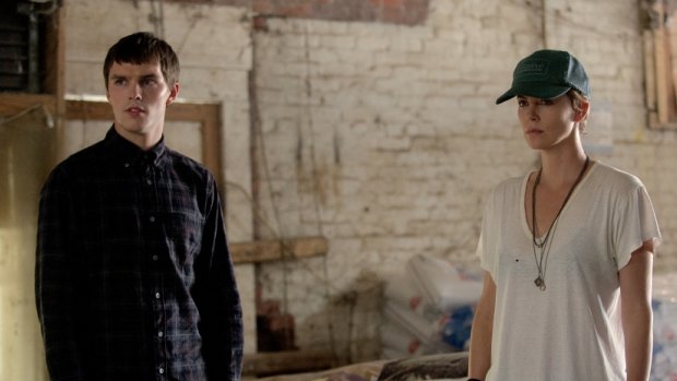 Nicholas Hoult, left, as Lyle Wirth and Charlize Theron as Libby Day in <i>Dark Places</i>. 