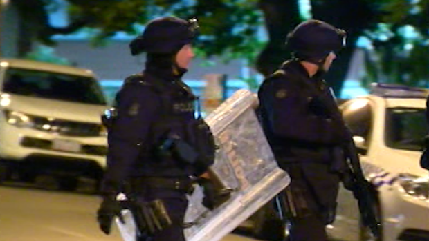 Police in full riot gear prepare to enter the Parkville youth centre. 