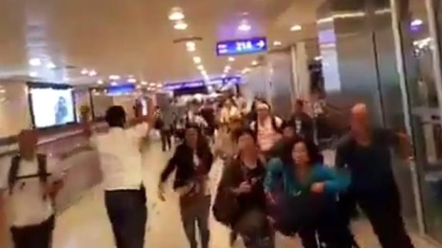 Travellers in airport fleeing the blasts, caught on CCTV.