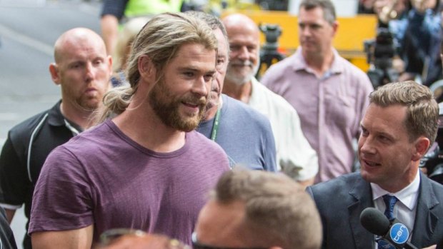 Chris Hemsworth meets fans during filming. 