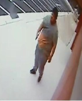 A CCTV image of a man who allegedly carried a machete into an Islamic school.
