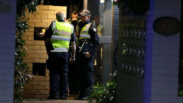 Police at the scene of the St Kilda apartment fire last night. 