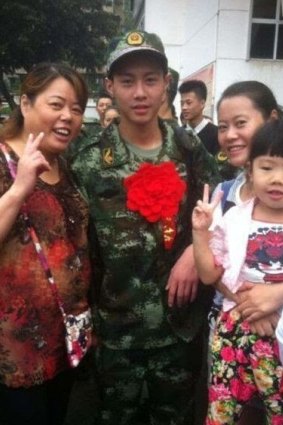 Firefighter Yuan Hai (centre) has reportedly died aged only 17. 