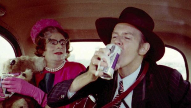Aunt Edna (Barry Humphries) with Barry Crocker in a London taxi in The Adventures of Barry McKenzie.
