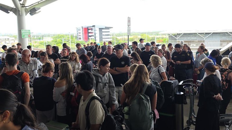 Brisbane Airport evacuated, flights delayed as smoke triggers alarm