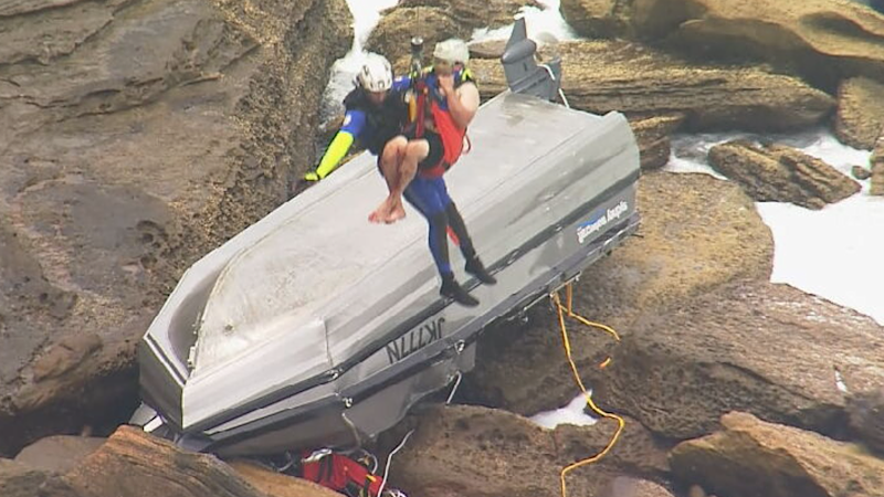 Man dead after boat flips off Sydney’s northern beaches, teen feared missing