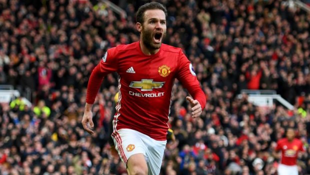 Juan Mata celebrates scoring the opener in Manchester United's 1-1 draw with Arsenal.