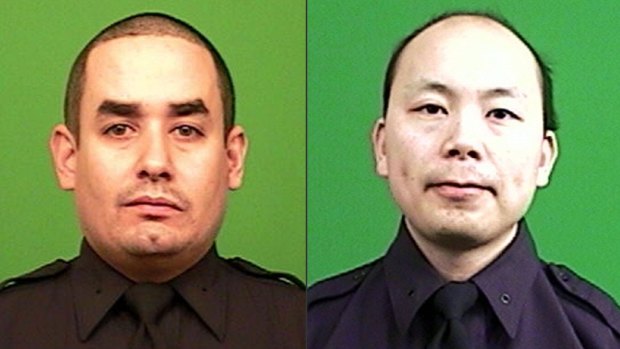 Shot dead: New York Police Department officers Rafael Ramos and Wenjian Liu. 