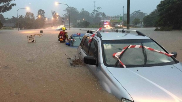 A car under water during severe weather in SEQ on Friday.