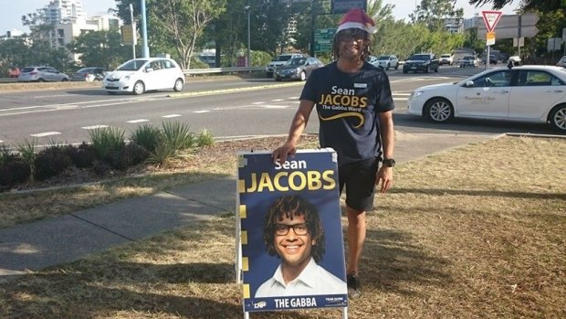 LNP candidate for The Gabba, Sean Jacobs, with his Brisbane City Council-inspired corflute.