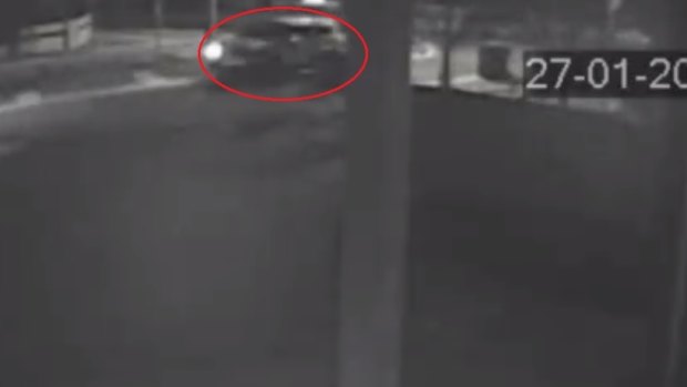 An image taken from CCTV footage of an SUV with a broken headlight at the scene.