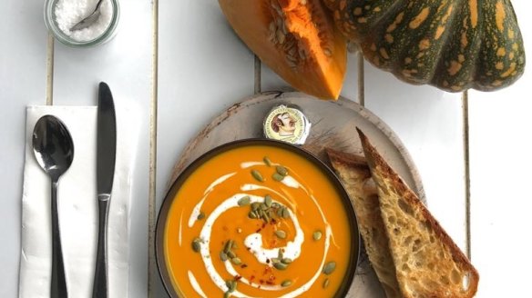 Roasted pumpkin soup with lemongrass, coconut and ginger Soup with toasted pepitas warm bread and Pepe Saya butter from Blackwood Pantry