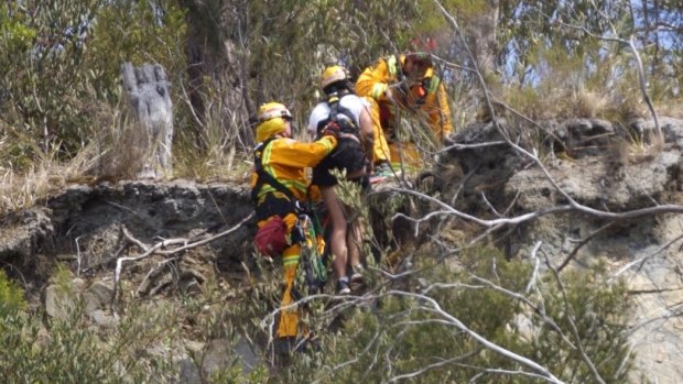 CFA members help the woman reach safety.