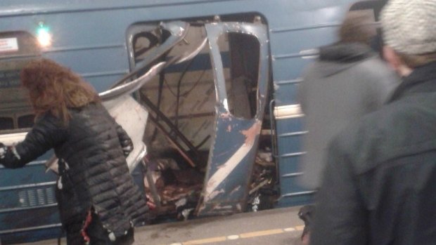 Damaged train doors after an explosion in a Russian metro station.