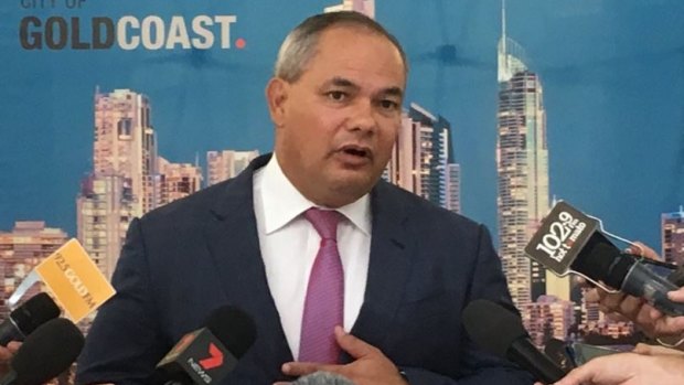 Gold Coast mayor Tom Tate lashed out at federal bureaucrats after new figures revealed a four-hour 'peak-hour'.