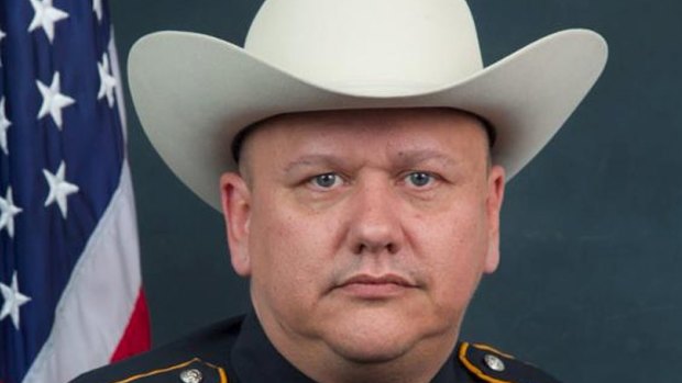 Deputy Darren Goforth was shot at point blank range while putting petrol in his patrol car in Houston.