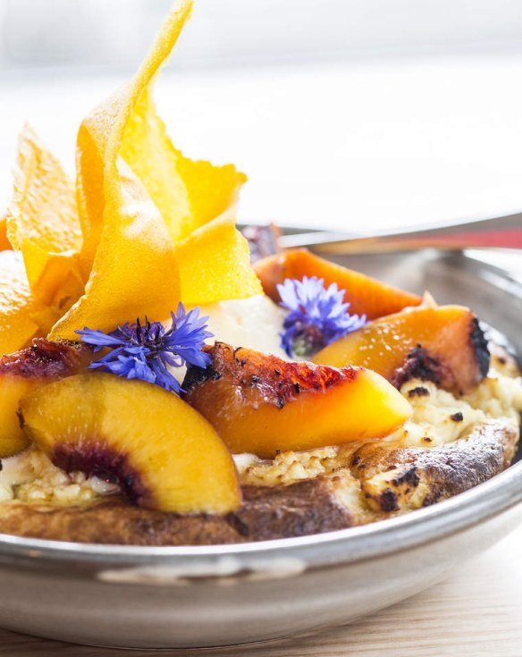 Ricotta hot cake with maple syrup, grilled peaches and cream at Barry in Northcote.