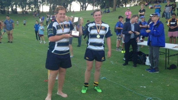 Brumbies under-17s captain Tom Ross and Ryan Lonergan with the Gold Cup trophy in Perth.