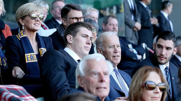 US Vice-President Joe Biden attends an AFL match between West Coast and Carlton at the MCG. With him were Maxson Cox and Foreign Minister Julie Bishop.
