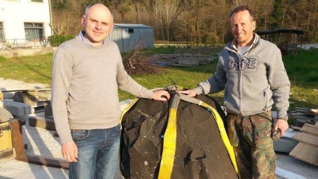Examining the boulder from Queensland that will be sculptured into a memorial to Bert Hinkler is (left) Cesare Ciabatti from the Da Gioncondo Chalet and (right) sculptor Roberto Vignali. 