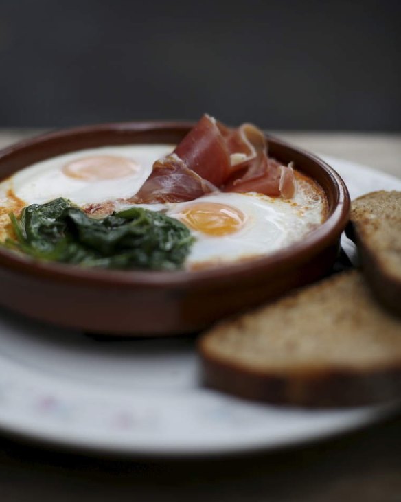 Soft baked eggs with jamon, ramchero and rye from Reuben Hills in Surry Hills.