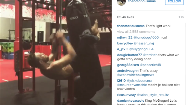 Power: Conor McGregor does extreme sit-ups.