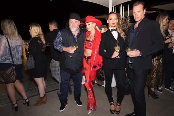 Kyle Sandilands with former fiancee Imogen Anthony, and best man Simon Main, far right, at a party in Double Bay in 2017.