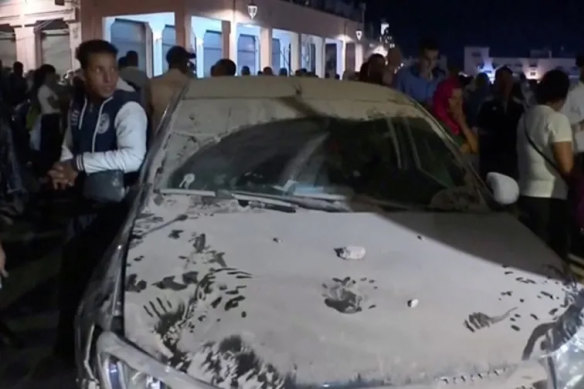A car is covered in dust in the aftermath of the earthquake in Marrakesh, Morocco. 