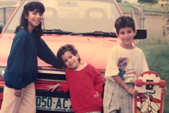 Cristina Williams, aged 10, left, in Queensland with her brother and sister as freshly arrived refugees from El Salvador. 