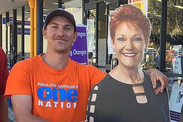 Former One Nation candidate Dean Smith, who underwent a recruitment interview with US-based neo-Nazi group The Base, with a cutout of Pauline Hanson.