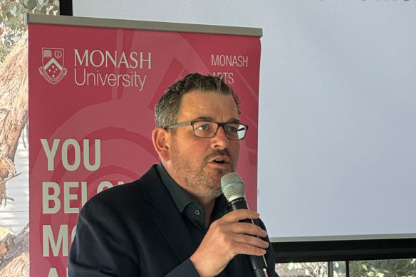 A bearded former premier Dan Andrews addresses Monash University students.