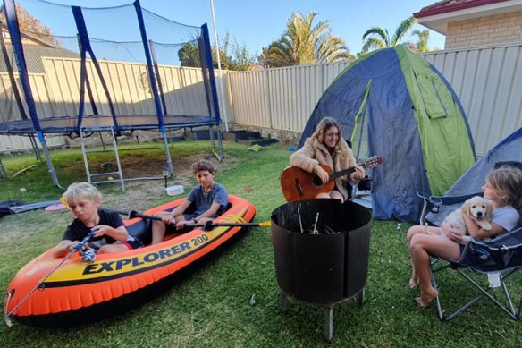 Trent, 11, Blake, 12, Hayley ,16, Abbey, 9, and 8-week old puppy Bella enjoy their Easter backyard camp out in Perth.