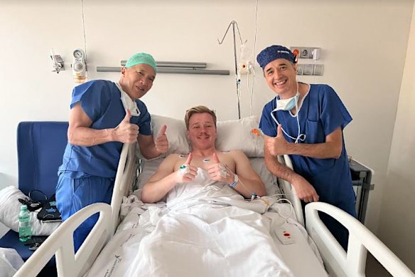 Billy Baldwin with Charlie Teo after having a tumour removed from his lower back in the Hospital Universitario Fundacion Jimenez Diaz in Madrid, Spain.