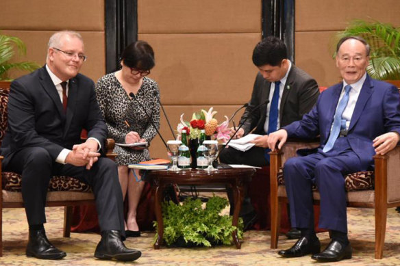 Scott Morrison meets with Chinese Vice-President Wang Qishan in Jakarta ahead of the inauguration.