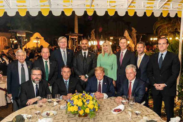 US President Trump hosted a working dinner for Brazilian President Jair Bolsonaro, at Mar-a-Lago last year. The Brazilian ambassador, Nestor Forster, standing behind Bolsonaro, then tested positive for coronavirus.