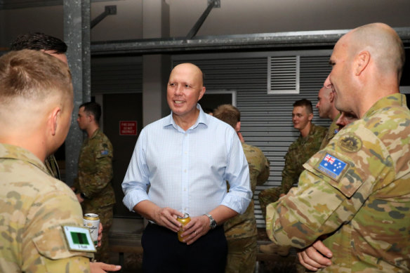 Peter Dutton met soldiers in Townsville last month.