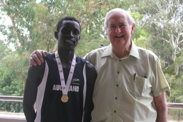 Peter Bol with Brian Moore, the father of his teacher Helen Leahy, who helped nurture his talent. 