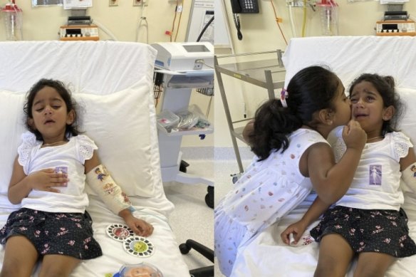 Tharnicaa and her sister Kopika in hospital on Christmas Island on June 6. 