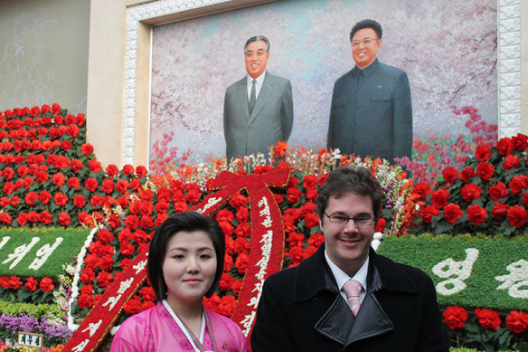 Michael Ruffles with a guide to a North Korean flower exhibition in 2012.