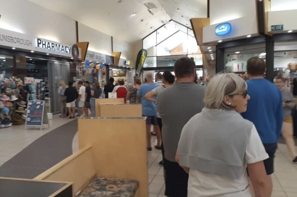 People in Dunsborough queue up for the pharmacy, despite the South West region not being subject to lockdown restrictions. 
